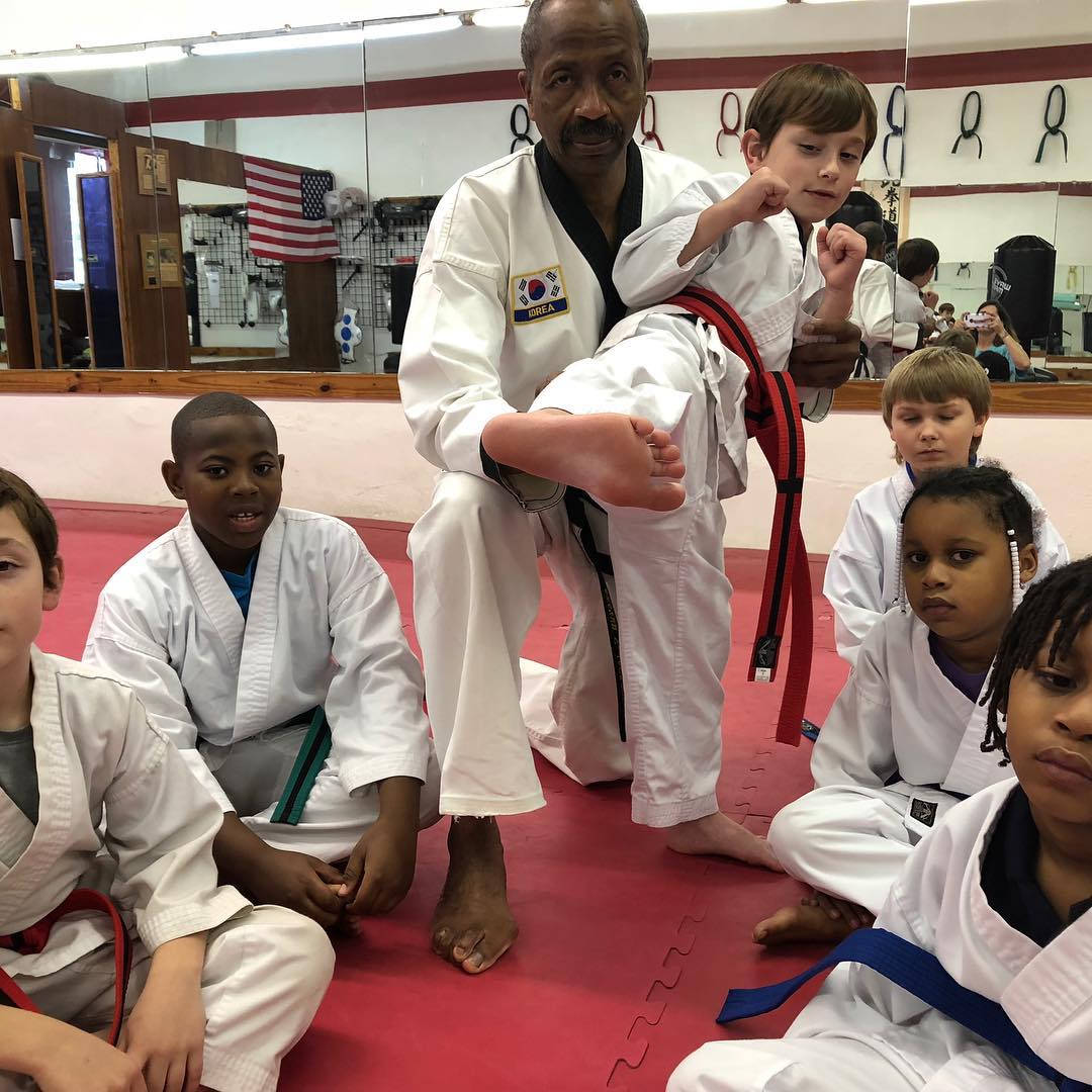 Childern practicing with master